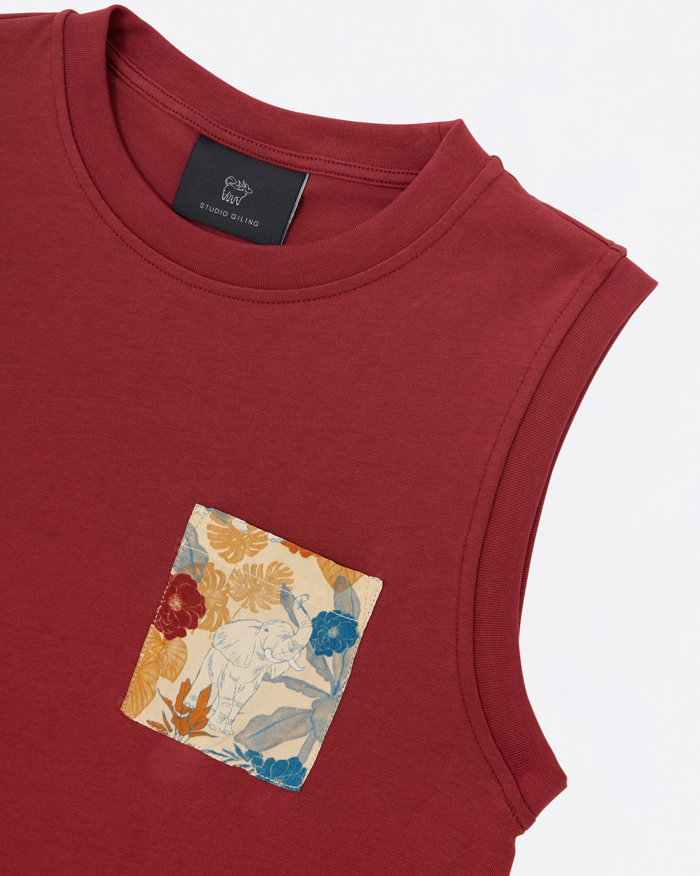 Red sleeveless cotton tank dress with a printed pocket design on a white background