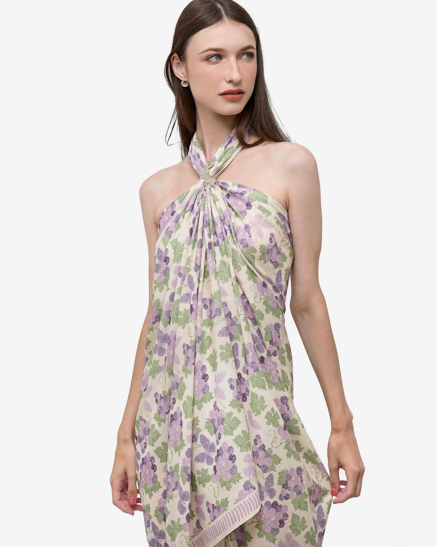 Woman wearing Amethyst Grapes Vanilla pareo as a halter dress — Studio Qiling hand-drawn floral luxury resort pareo Singapore