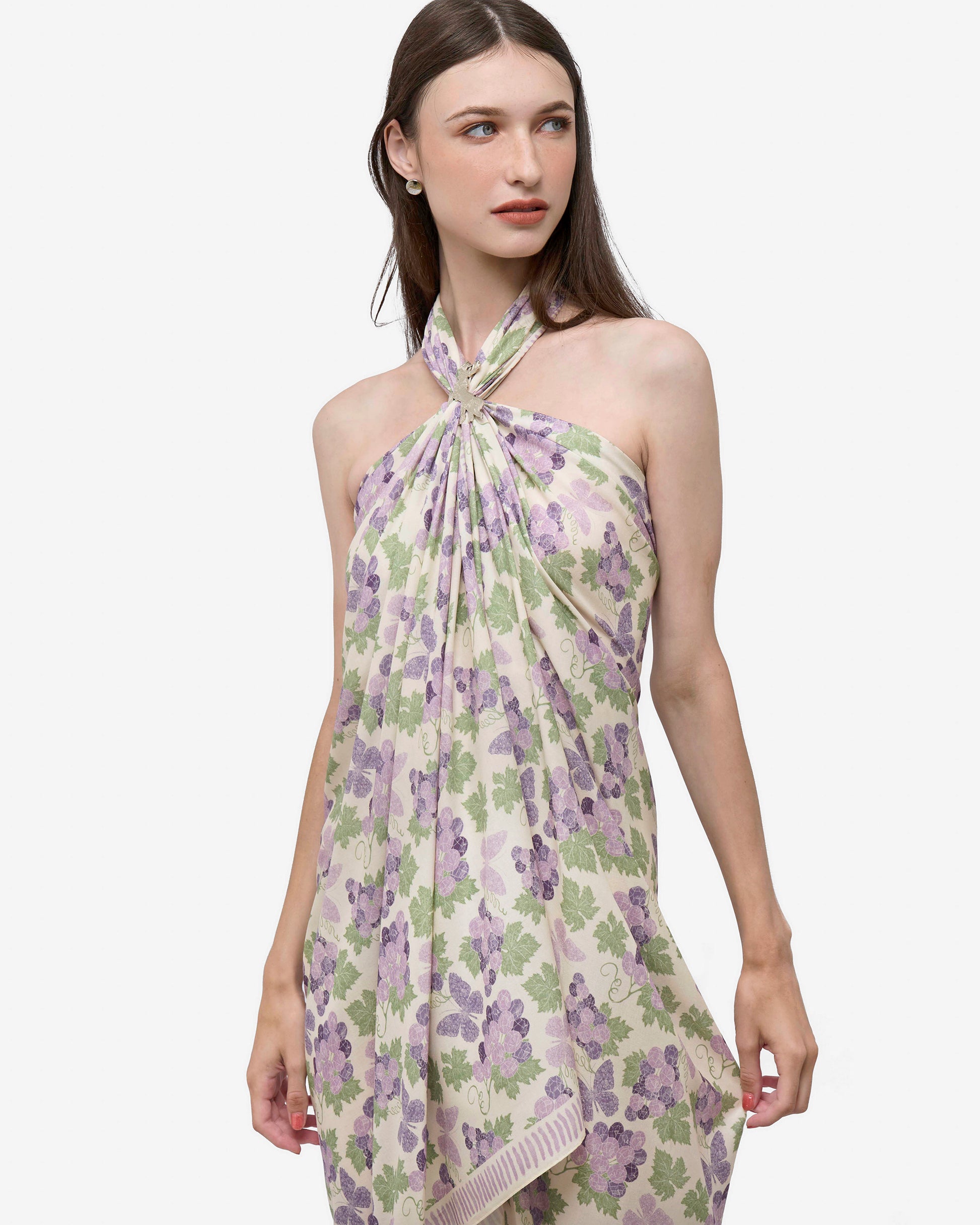 Woman wearing Amethyst Grapes Vanilla pareo as a halter dress — Studio Qiling hand-drawn floral luxury resort pareo Singapore
