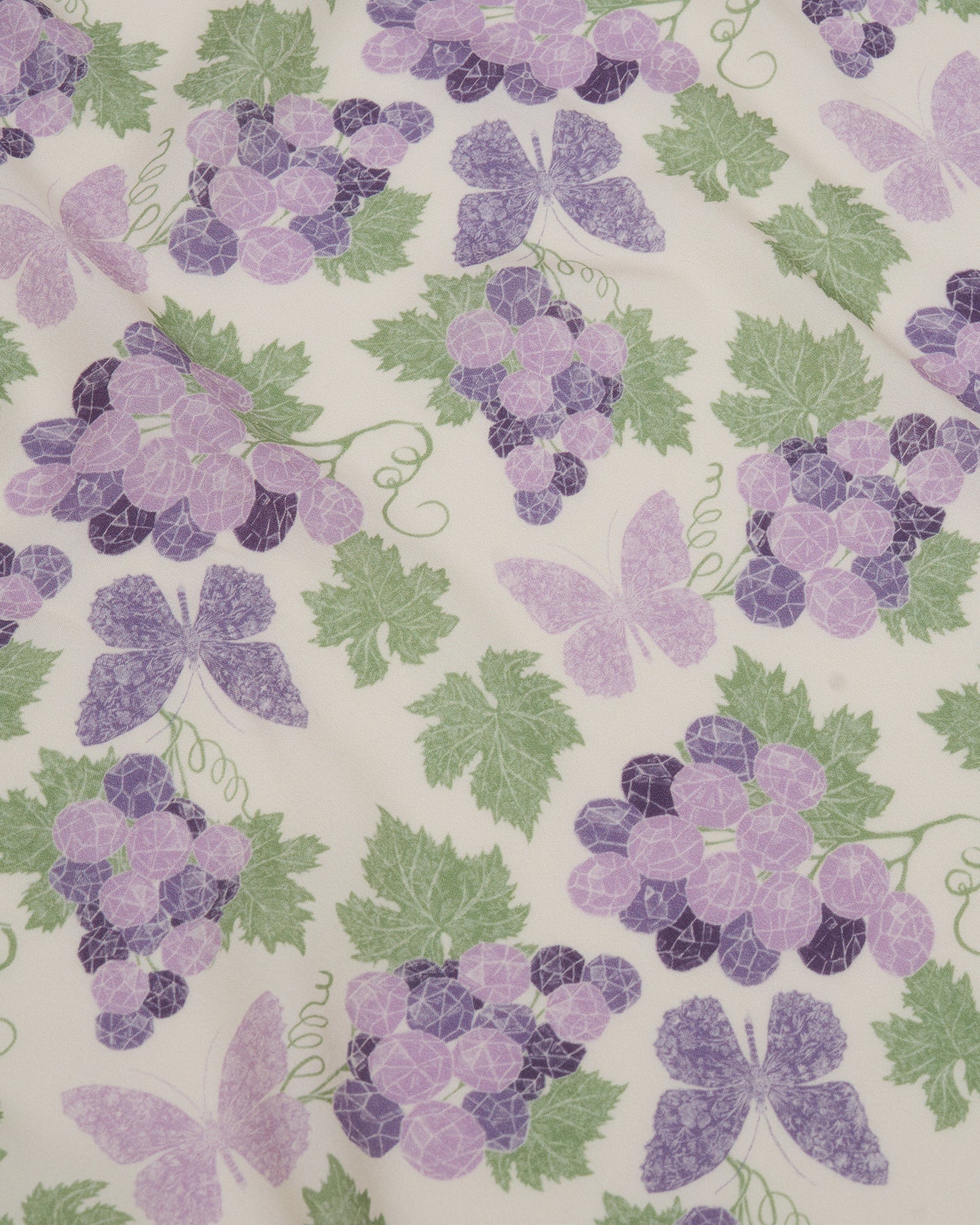 Amethyst Grapes Vanilla pareo laid flat — Studio Qiling hand-drawn grape cluster luxury resort beach wrap Singapore