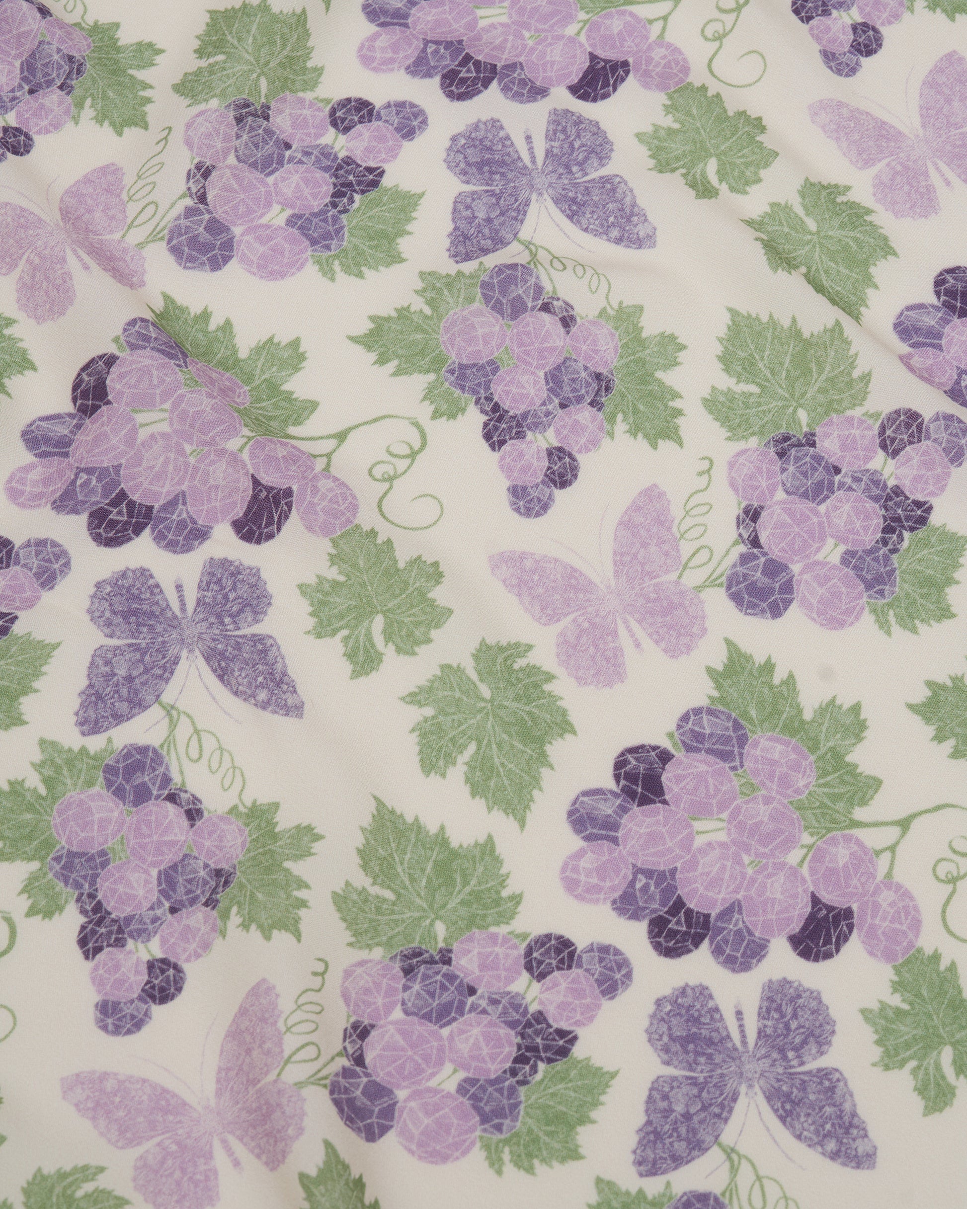 Amethyst Grapes Vanilla pareo laid flat — Studio Qiling hand-drawn grape cluster luxury resort beach wrap Singapore