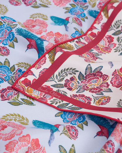 Crimson Sunbird Scarlet Sky reversible silk scarf laid flat showing both sides — Studio Qiling double-sided luxury scarf Singapore