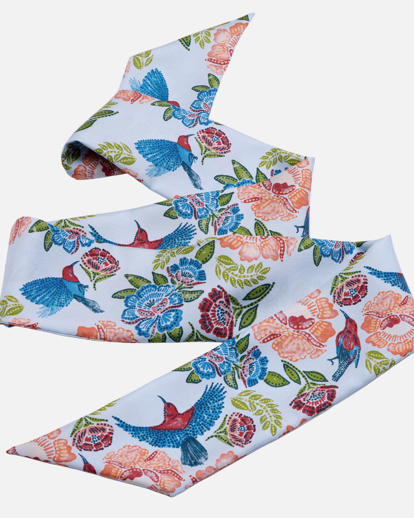 Woman wearing Crimson Sunbird Sky silk bandeau as a hair tie — Studio Qiling Singapore Sunbird batik print luxury silk bandeau