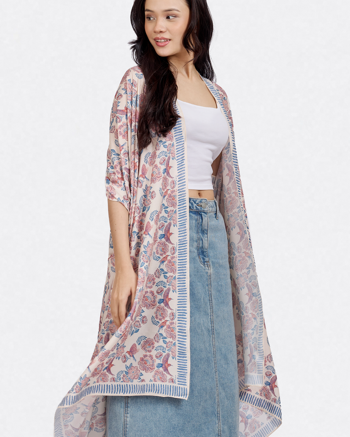 Woman wearing the Crimson Sunbird Spring pareo as a shawl — Studio Qiling hand-drawn Crimson Sunbird beach cover-up Singapore