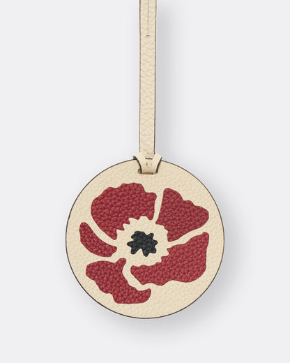 Reverse of ivory poppy leather bag charm with gold foil initials personalisation