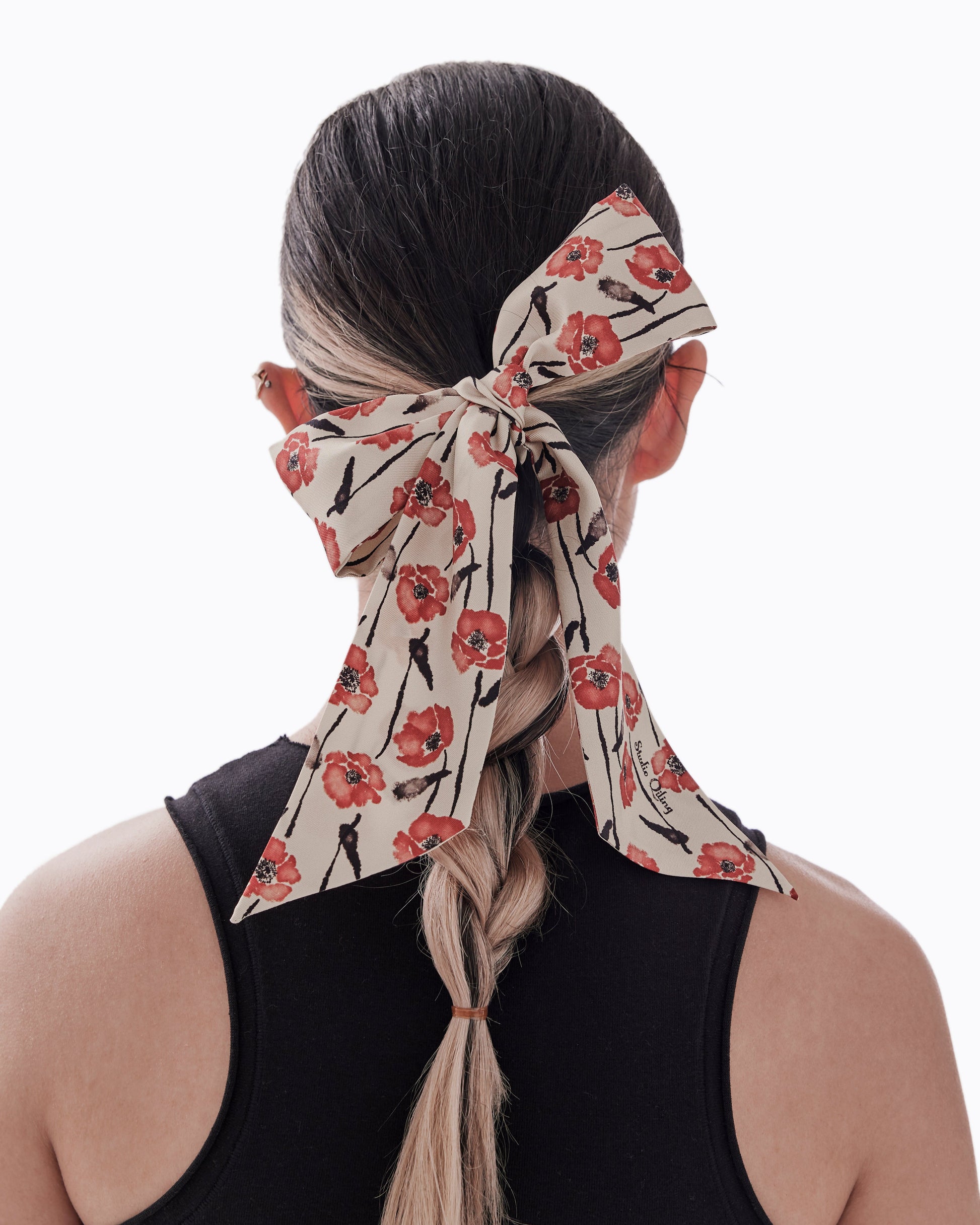 Woman wearing Dancing Poppies Mod silk bandeau as a hair tie — Studio Qiling hand-drawn floral luxury silk bandeau Singapore