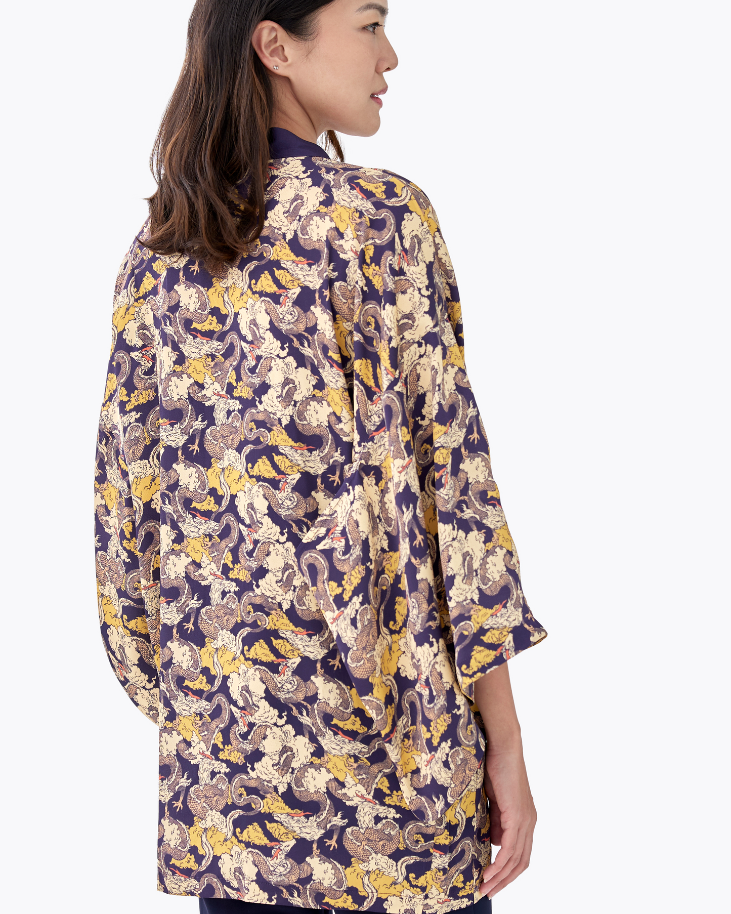 Close-up of hand-drawn dragon motif on Dragon Golden Eclipse silk blend kimono — Studio Qiling luxury outerwear Singapore