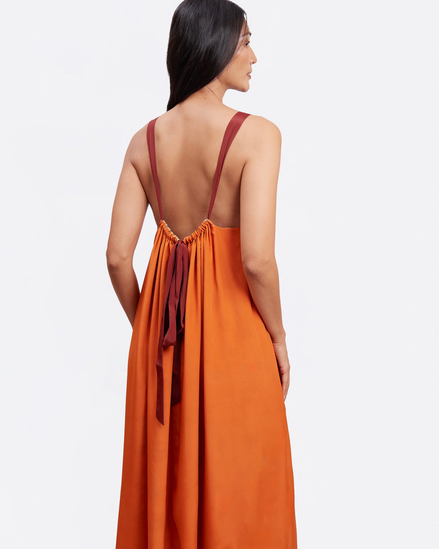 Woman wearing Elephant Woods reversible silk blend maxi dress showing the reverse side — Studio Qiling luxury wearable art Singapore