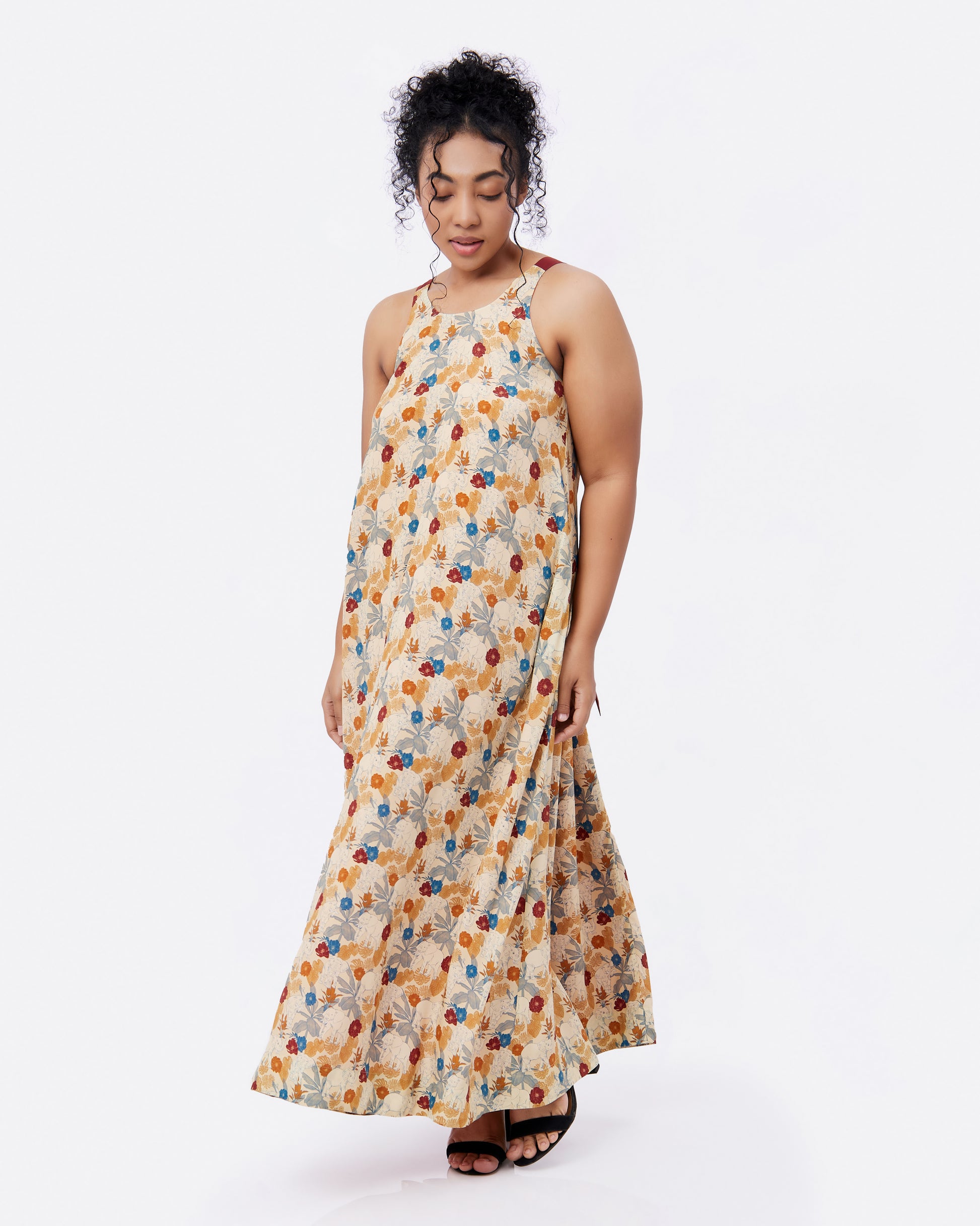 Elephant Woods reversible silk blend maxi dress in an outdoor setting — Studio Qiling hand-drawn elephant print luxury dress Singapore