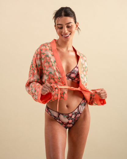 Studio Qiling x Perk by Kate. Woman wearing a patterned lingerie set and matching kimono style robe with ribbon tie detail