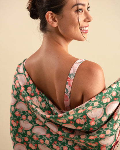 Studio Qiling x Perk by Kate. Woman draping a emerald green reversible silk scarf.