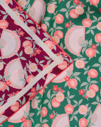 Reversible patterned silk scarf in deep red on one side and emerald green colour on the other side with hand drawn prints