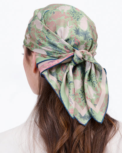 Close-up of hand-drawn Jackalope mythical creature print on reversible silk scarf — Studio Qiling Singapore designer luxury scarf