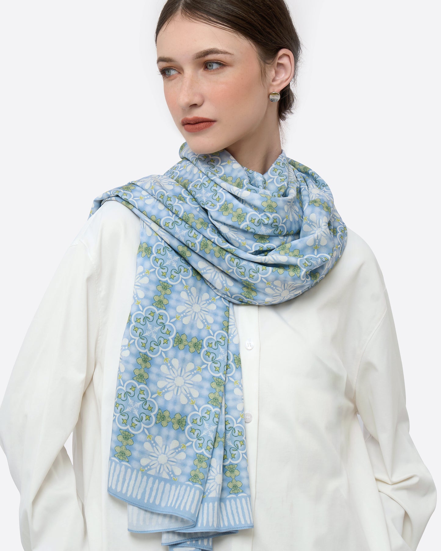 Close-up of hand-drawn Peranakan orchid motif on Cornflower pareo — Studio Qiling Singapore heritage luxury beach wrap