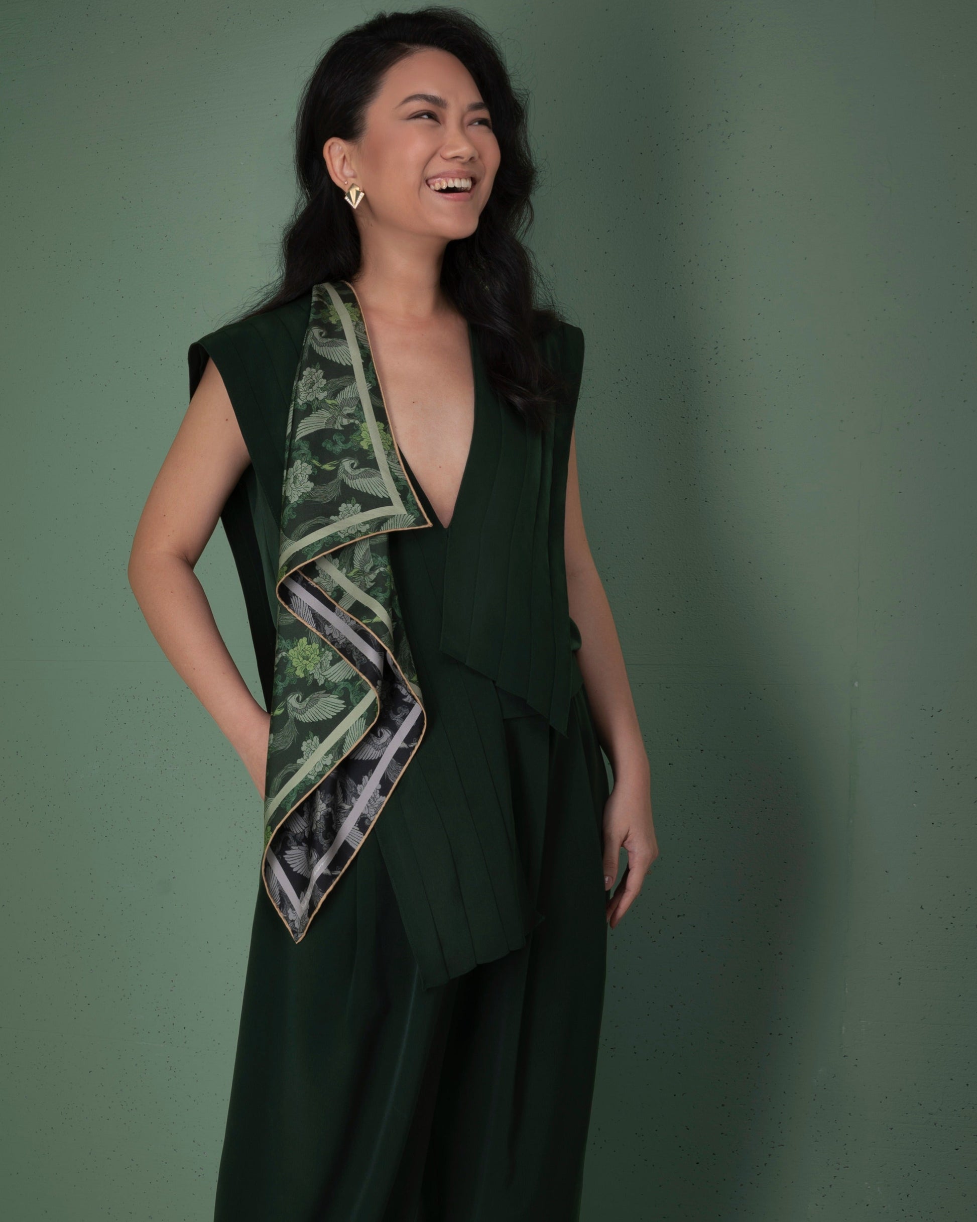 Woman wearing Phoenix Night Jade double-sided 65cm silk scarf as a neck wrap — Studio Qiling hand-drawn phoenix luxury scarf