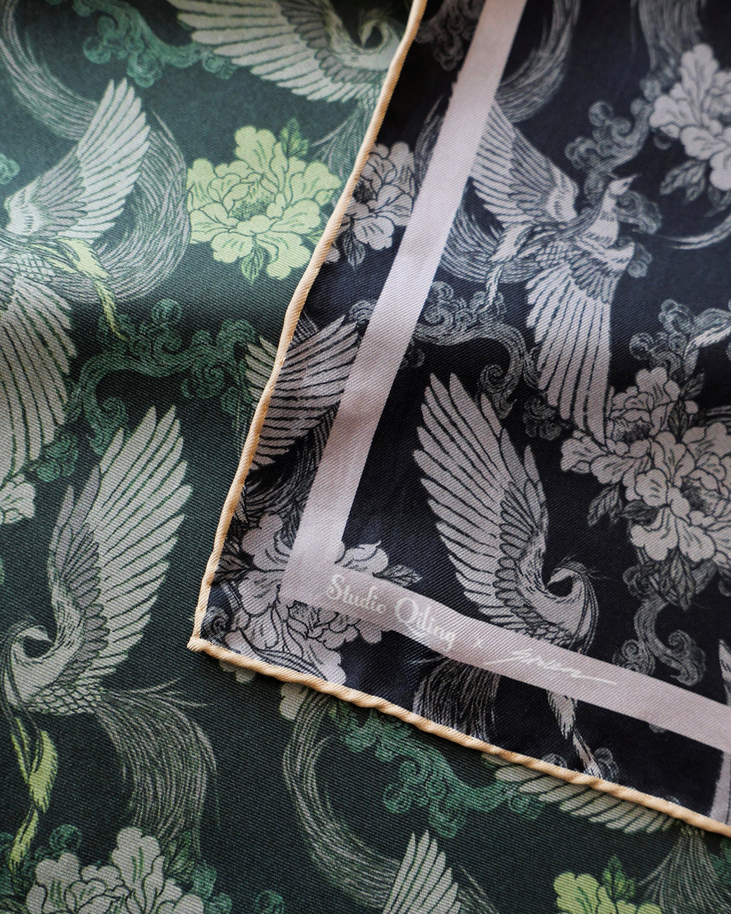 Phoenix Night Jade reversible silk scarf laid flat showing both sides — Studio Qiling hand-drawn phoenix print double-sided luxury scarf Singapore