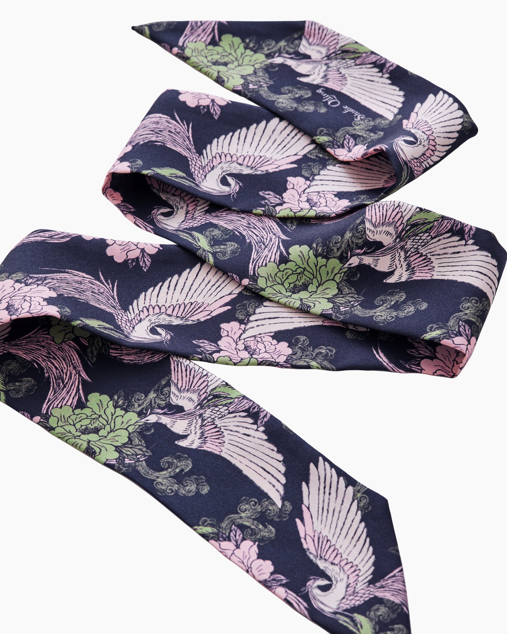 Woman wearing Phoenix Pink Sage silk bandeau as a hair tie — Studio Qiling hand-drawn phoenix print luxury silk bandeau Singapore