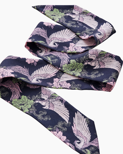 Woman wearing Phoenix Pink Sage silk bandeau as a hair tie — Studio Qiling hand-drawn phoenix print luxury silk bandeau Singapore