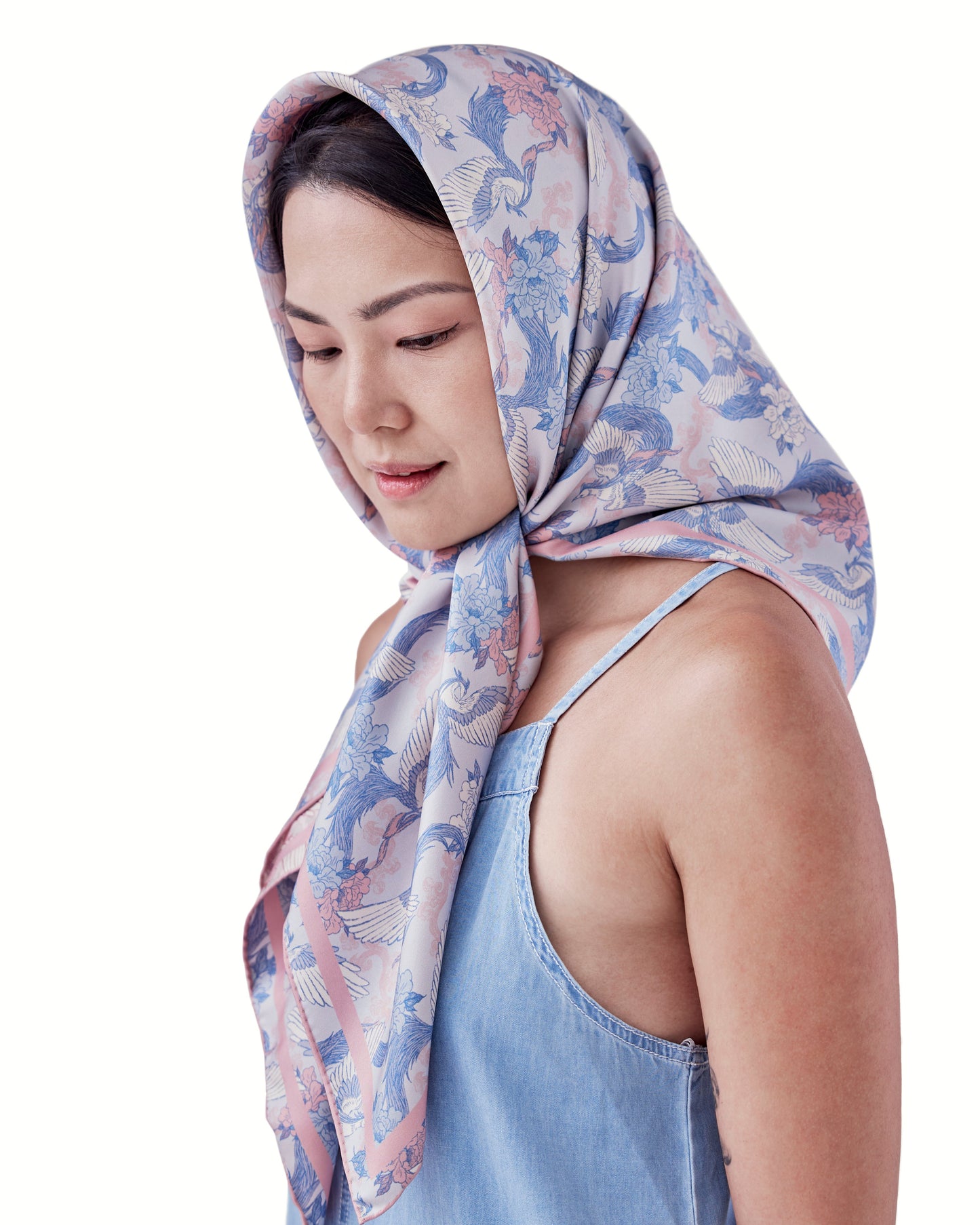 Close-up of hand-drawn phoenix motif on Phoenix Sakura Sky reversible silk scarf — Studio Qiling Singapore designer luxury scarf