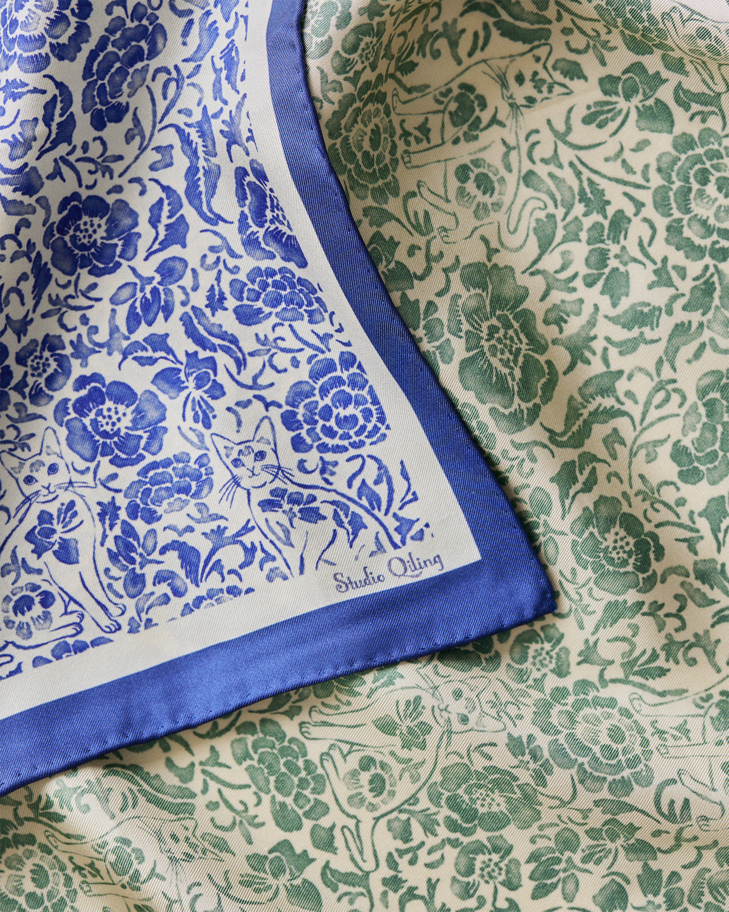 Porcelain Cat Classic Green reversible silk scarf styled as a neck scarf — Studio Qiling hand-drawn Singapura cat wearable art Singapore