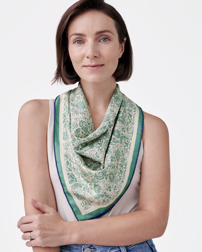 Woman wearing Porcelain Cat Classic Green reversible silk scarf as a neck wrap — Studio Qiling Peranakan heritage luxury scarf Singapore
