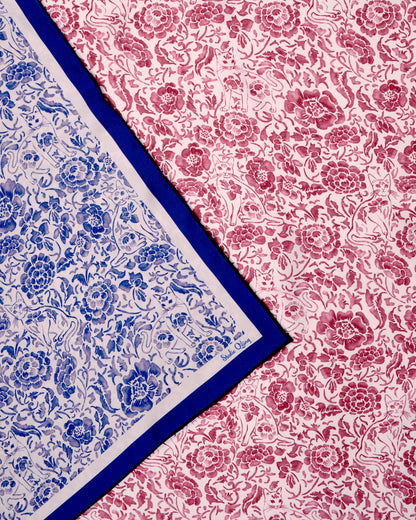 Double-sided reversible silk scarf with hand-drawn original art drawn in porcelain style with florals in red and white on one side and blue and white on the other side