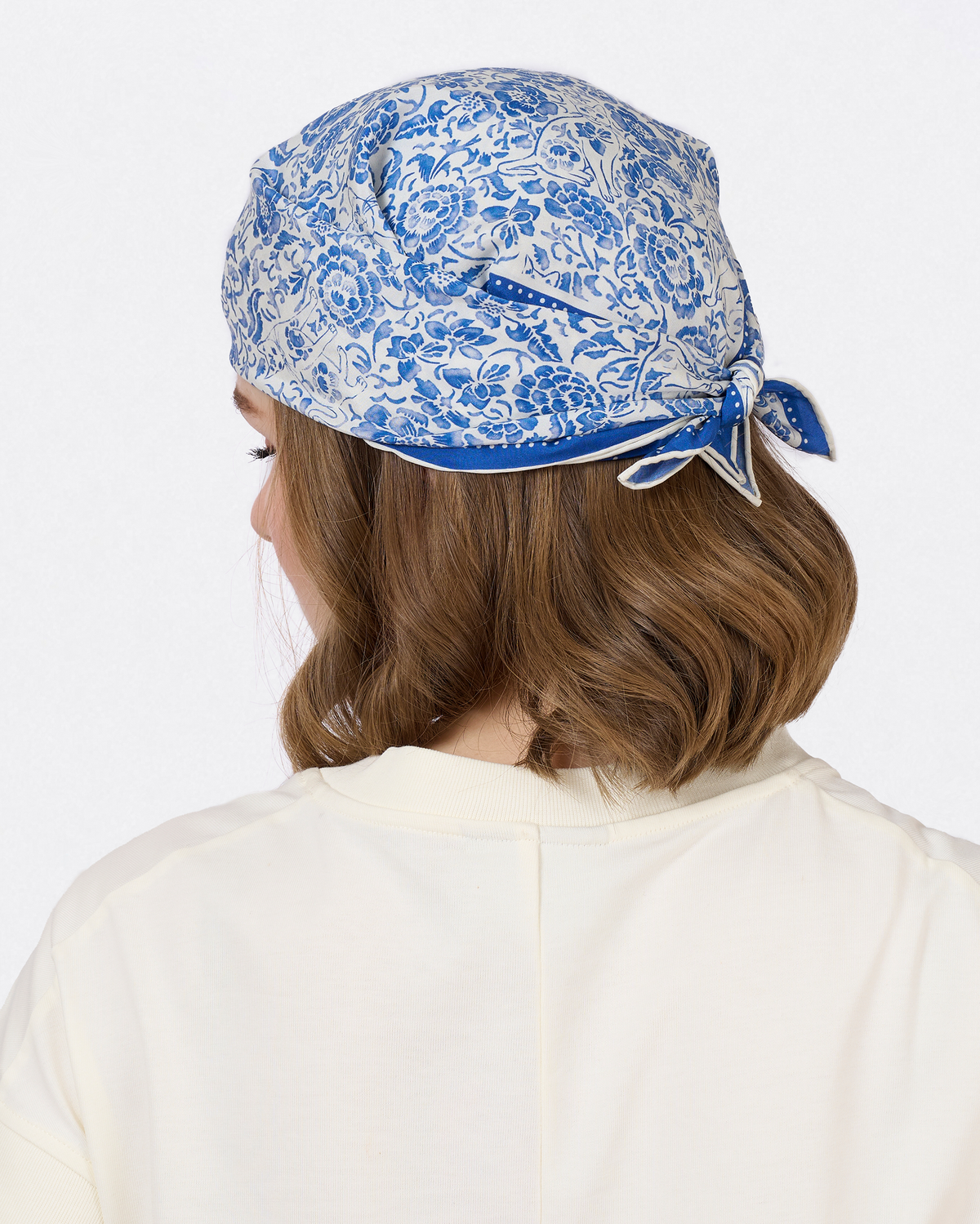 Woman wearing the Porcelain Cat Classic silk-cotton bandana as a neck scarf — Studio Qiling hand-drawn Singapura cat bandana Singapore