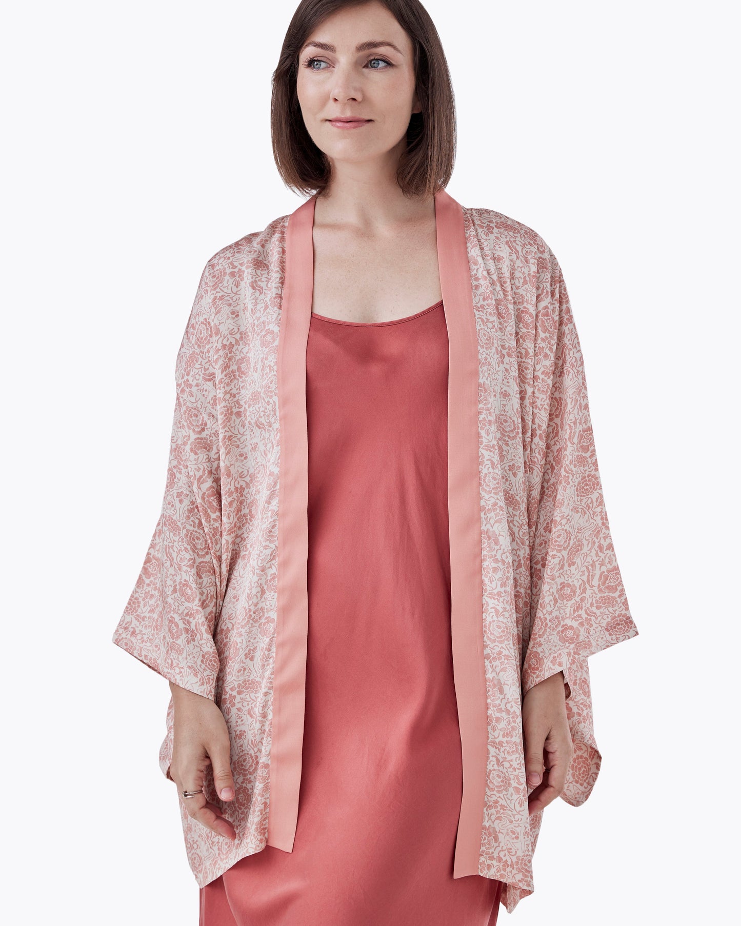 Woman wearing Porcelain Cat Tearose silk blend kimono open over a dress — Studio Qiling hand-drawn Peranakan print artist kimono Singapore