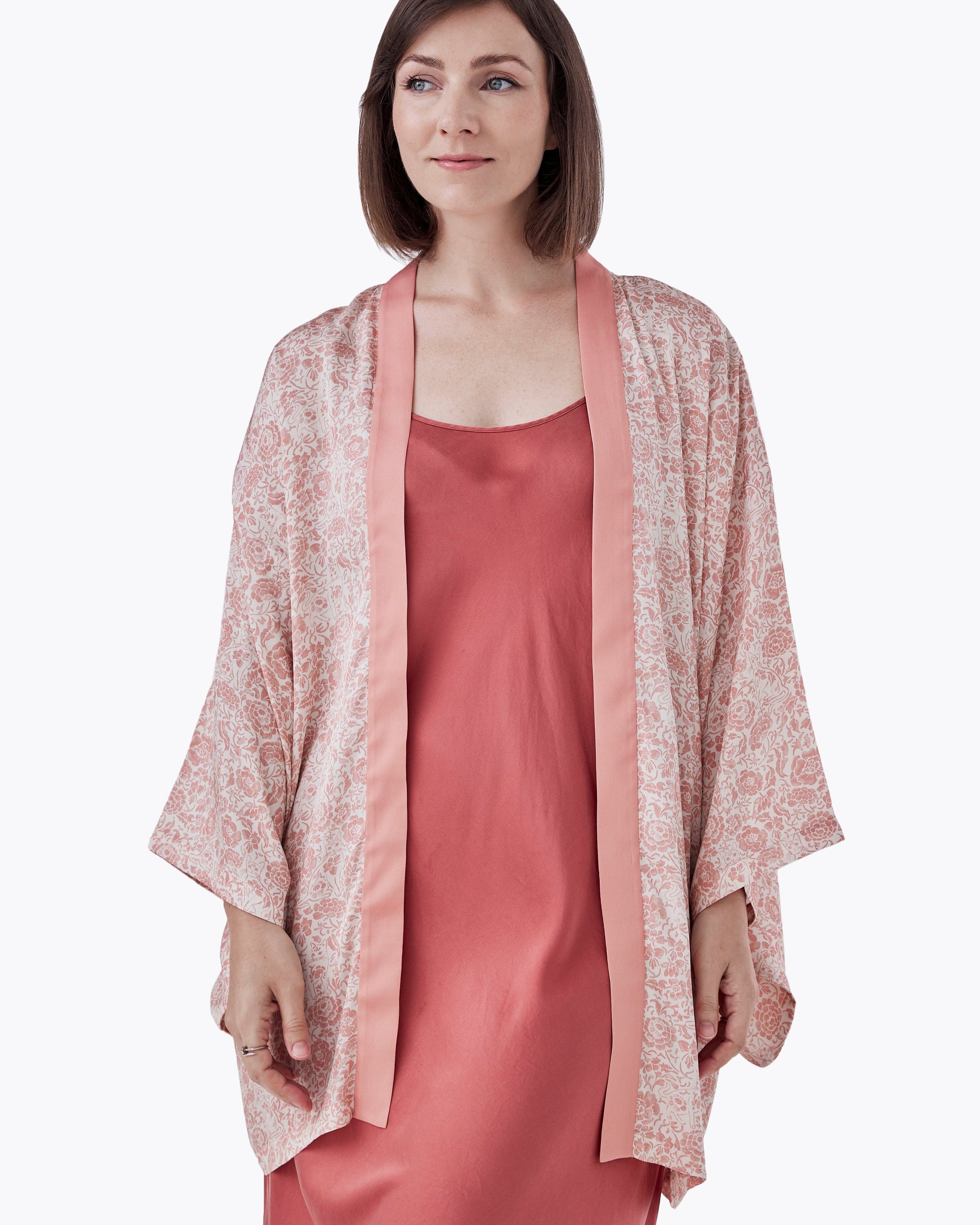 Woman wearing Porcelain Cat Tearose silk blend kimono open over a dress — Studio Qiling hand-drawn Peranakan print artist kimono Singapore