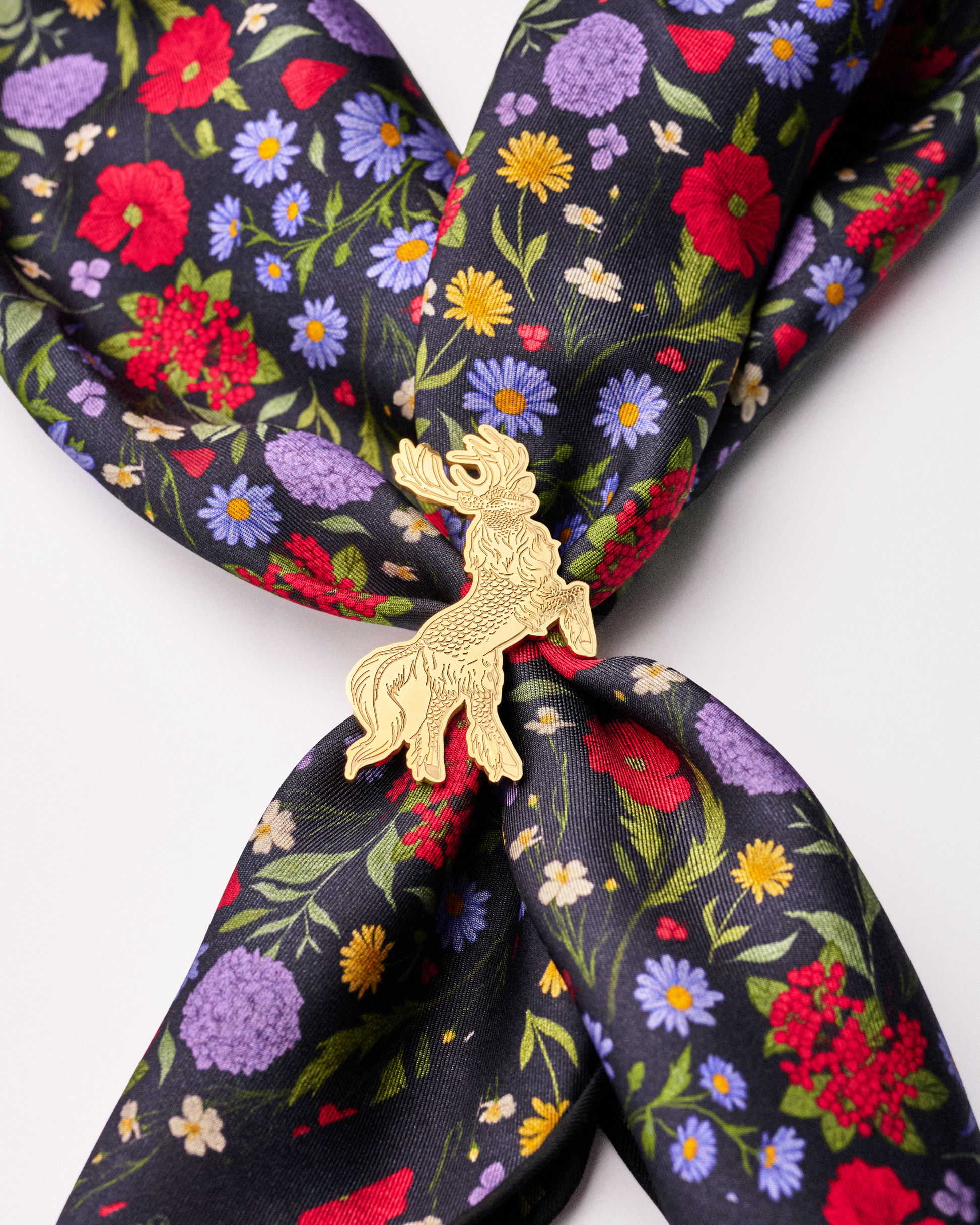 Qiling Courbette gold scarf ring flat lay with silk scarf — Studio Qiling designer reversible scarf ring Singapore