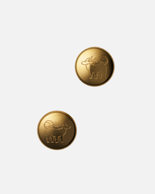 Qiling Pebble stud earrings in 18k gold-plated stainless steel with engraved Qiling emblem — Studio Qiling designer jewellery Singapore