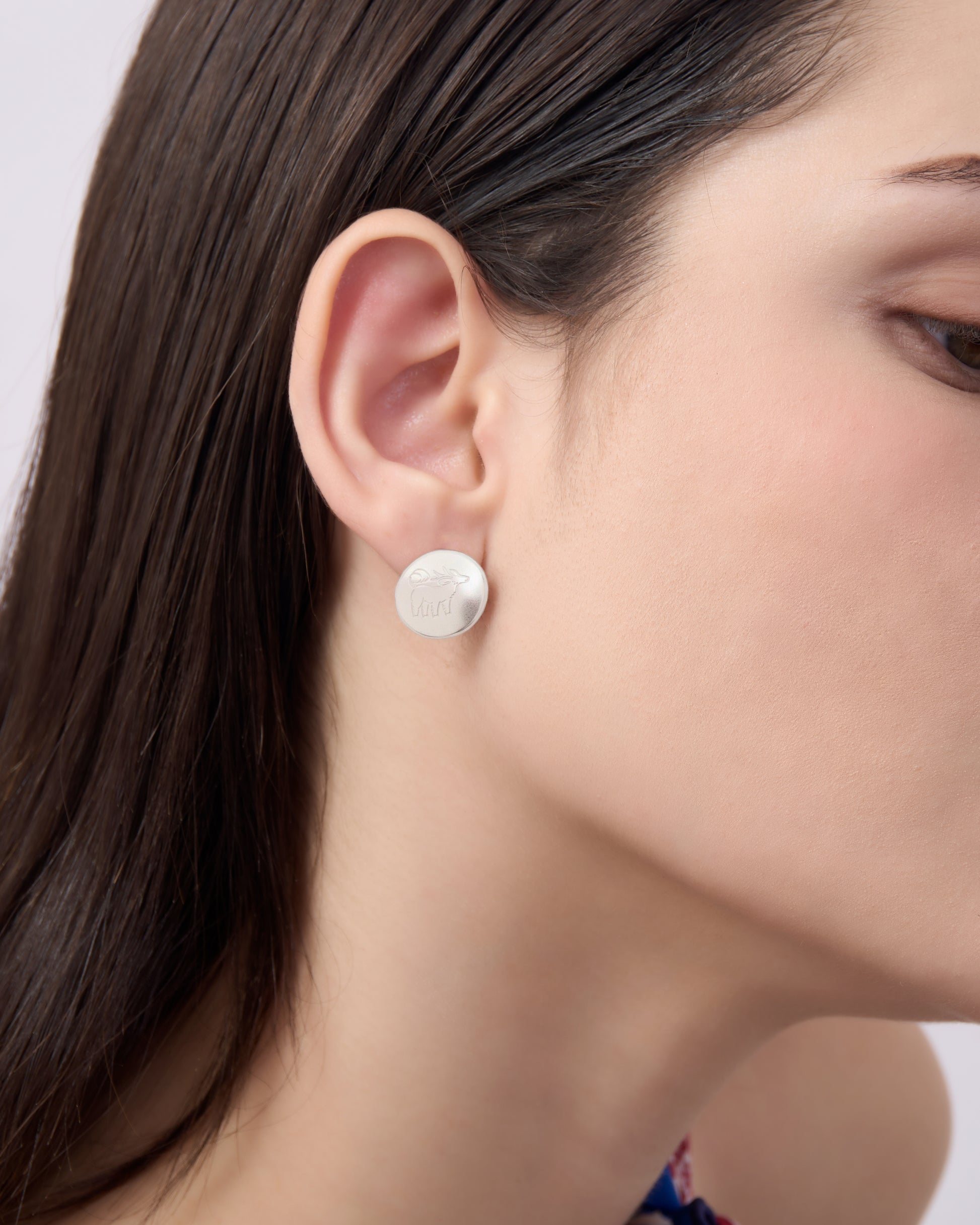 Qiling Pebble silver stud earrings worn — Studio Qiling luxury mythical creature jewellery Singapore