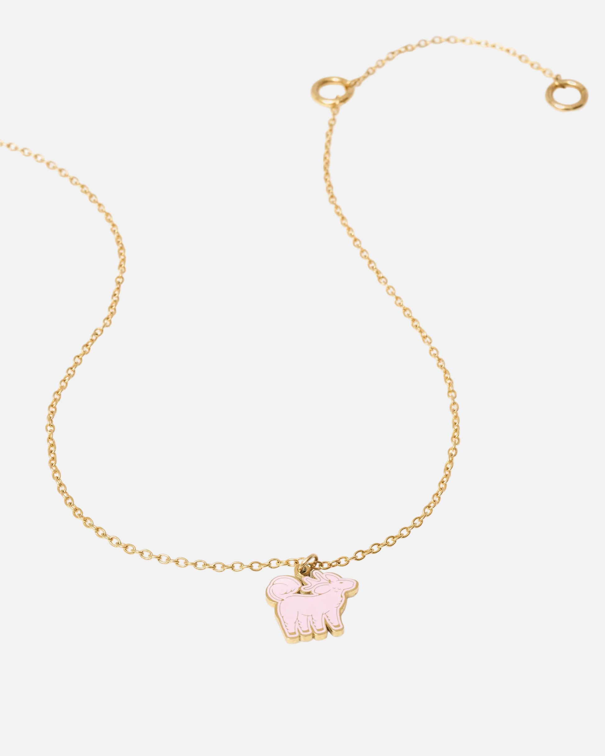 Rose Vert Qiling Duo gold necklace laid flat showing reversible pendant — Studio Qiling designer necklace Singapore