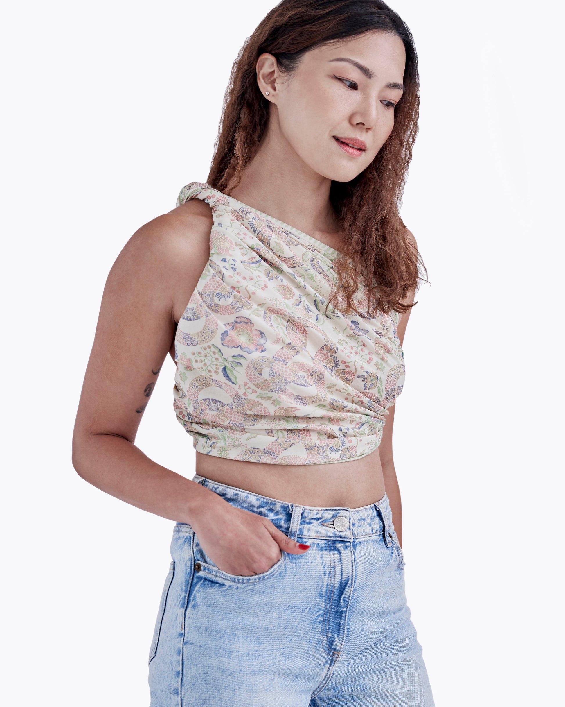 Serpentine Spring pareo styled as a sarong skirt — Studio Qiling wearable art luxury beach wrap Singapore