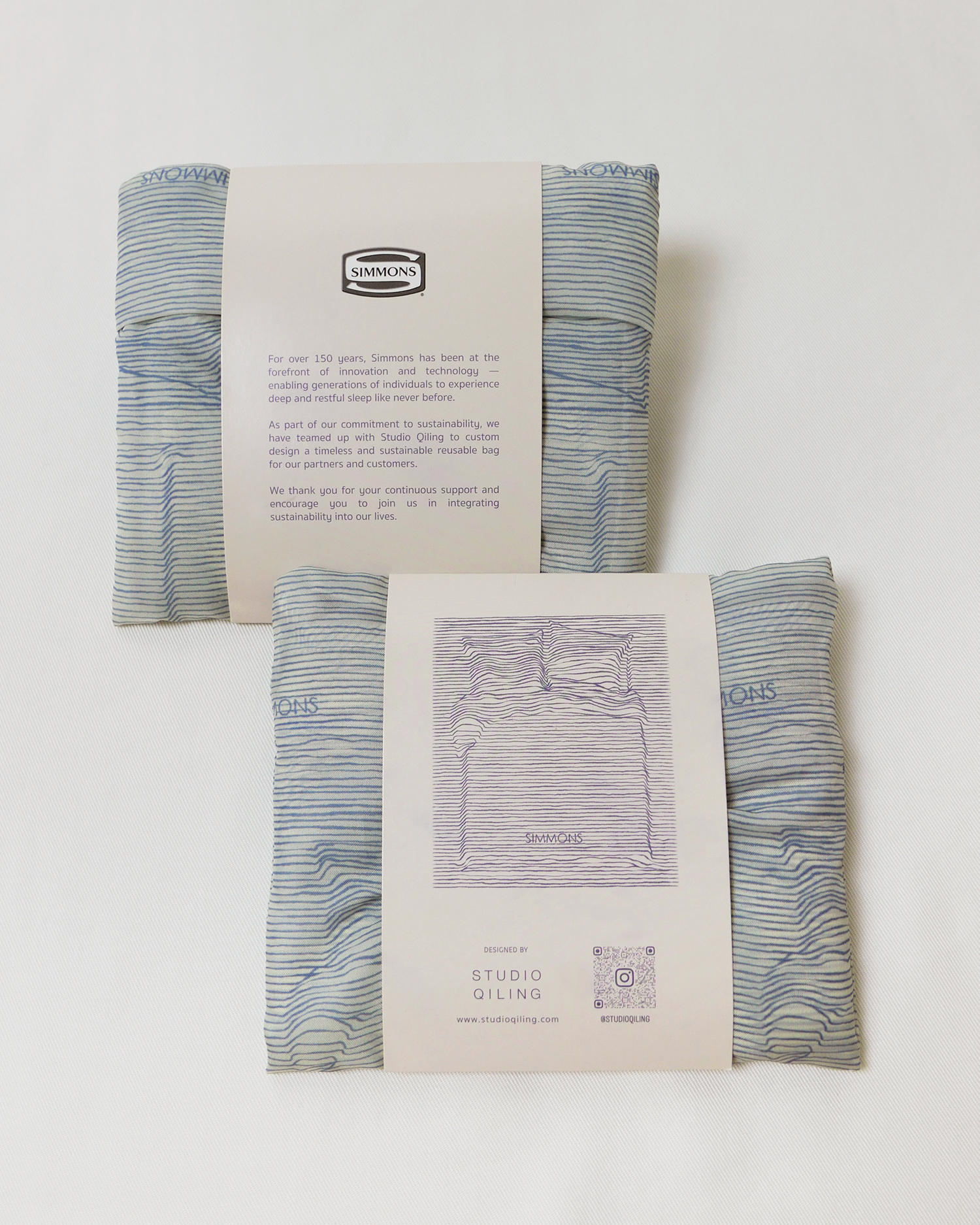 Foldable shopping bag customised in Simmons line-art print and packaging, sustainable corporate gift by Studio Qiling
