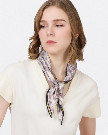 Close-up of hand-drawn Singapore Special dog and bougainvillea on the Lilac Summer silk scarf — Studio Qiling Singapore