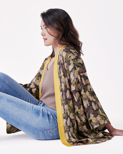 Woman wearing Tiger Autumn silk blend kimono open over a dress — Studio Qiling hand-drawn tiger print artist kimono Singapore