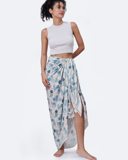 Woman wearing Tiger Blue pareo as a halter dress — Studio Qiling hand-drawn tiger print luxury resort pareo Singapore