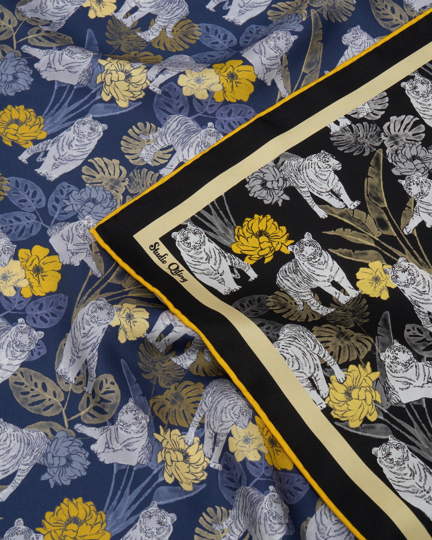 Woman wearing Tiger Navy Night reversible silk scarf — Studio Qiling wearable art luxury scarf Singapore