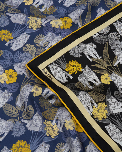 Woman wearing Tiger Navy Night reversible silk scarf — Studio Qiling wearable art luxury scarf Singapore