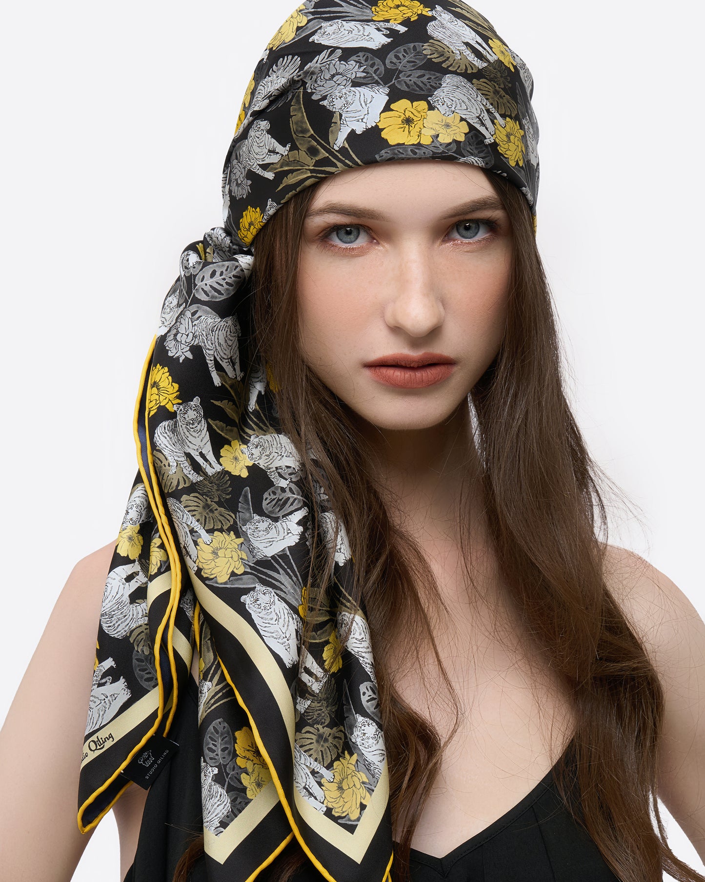 Close-up of hand-drawn tiger motif on reversible silk scarf in navy — Studio Qiling luxury silk scarf Singapore