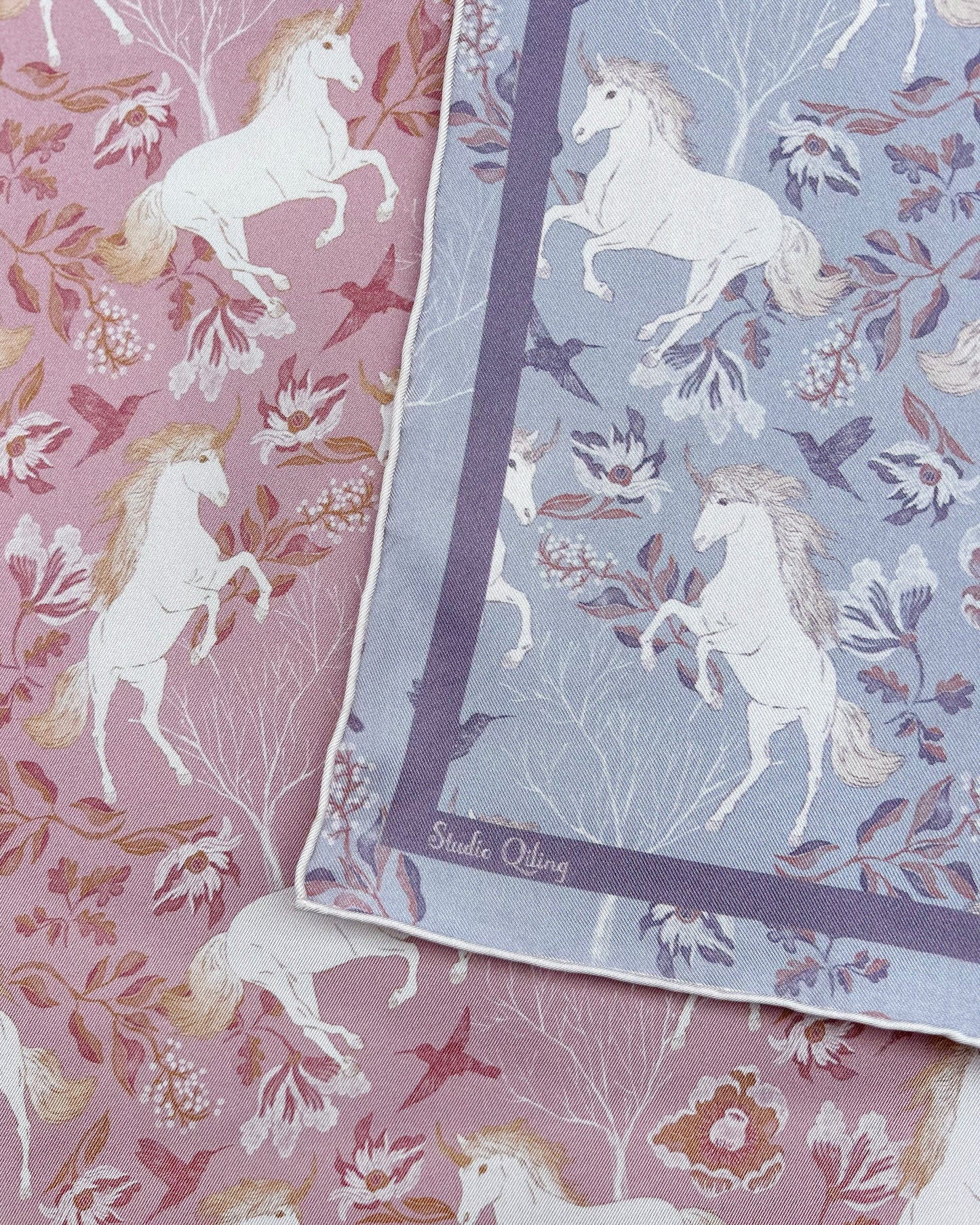 Woman wearing Unicorn Spring Magic reversible silk scarf as a neck wrap — Studio Qiling hand-drawn unicorn print luxury scarf