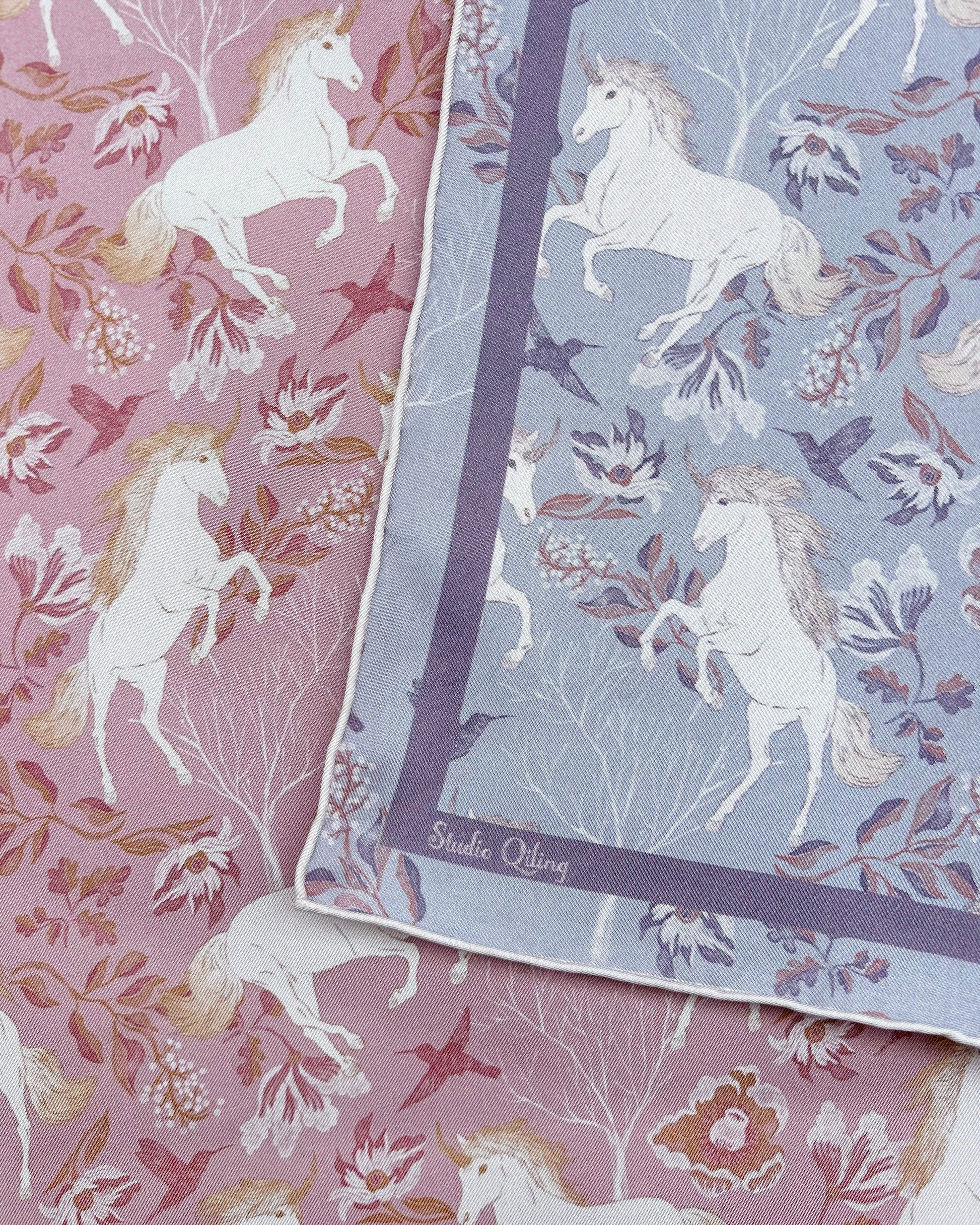 Woman wearing Unicorn Spring Magic reversible silk scarf as a neck wrap — Studio Qiling hand-drawn unicorn print luxury scarf