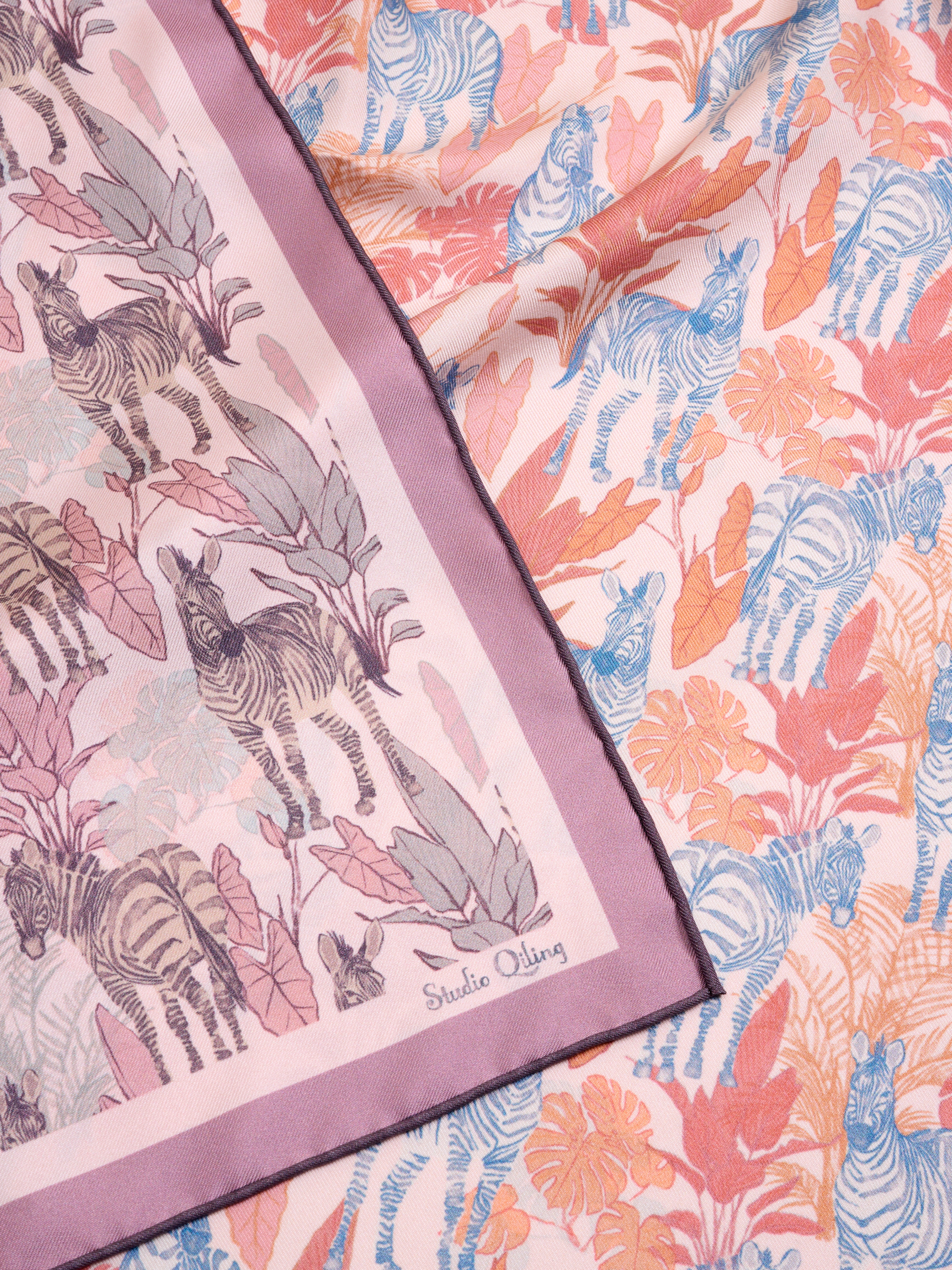 Patterned reversible fabric with zebra design and artwork