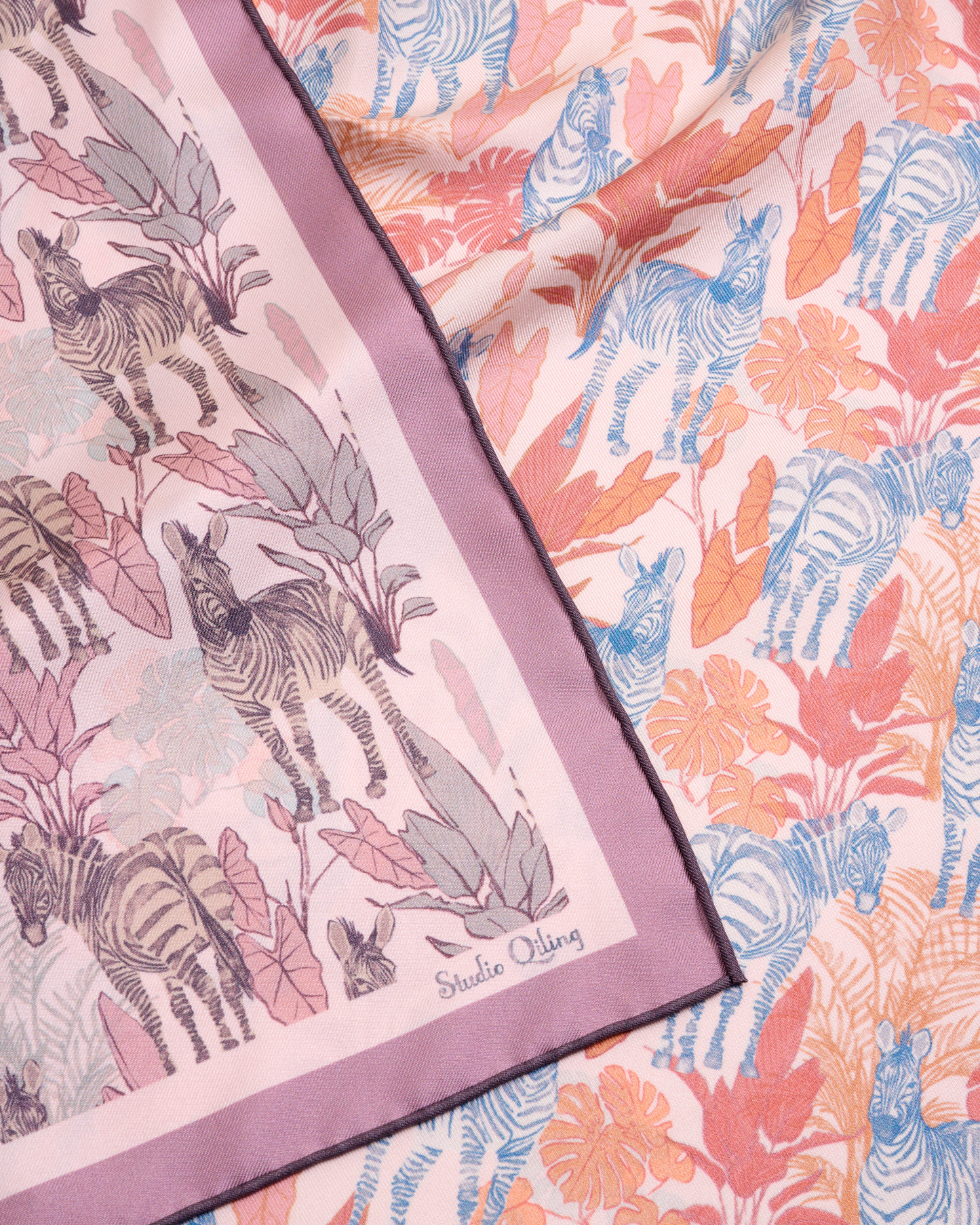Zebra Lilac Spring reversible silk scarf laid flat showing both sides — Studio Qiling double-sided luxury scarf Singapore