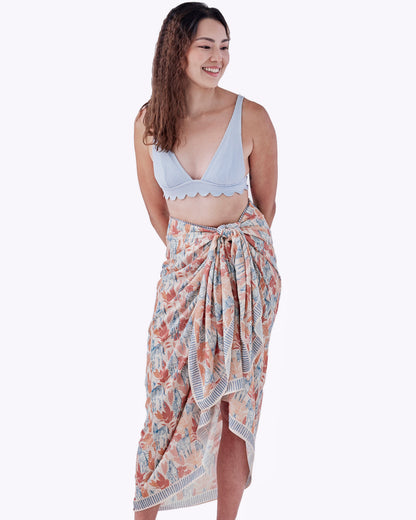 Zebra Sunset pareo styled as a sarong skirt — Studio Qiling wearable art luxury beach wrap Singapore