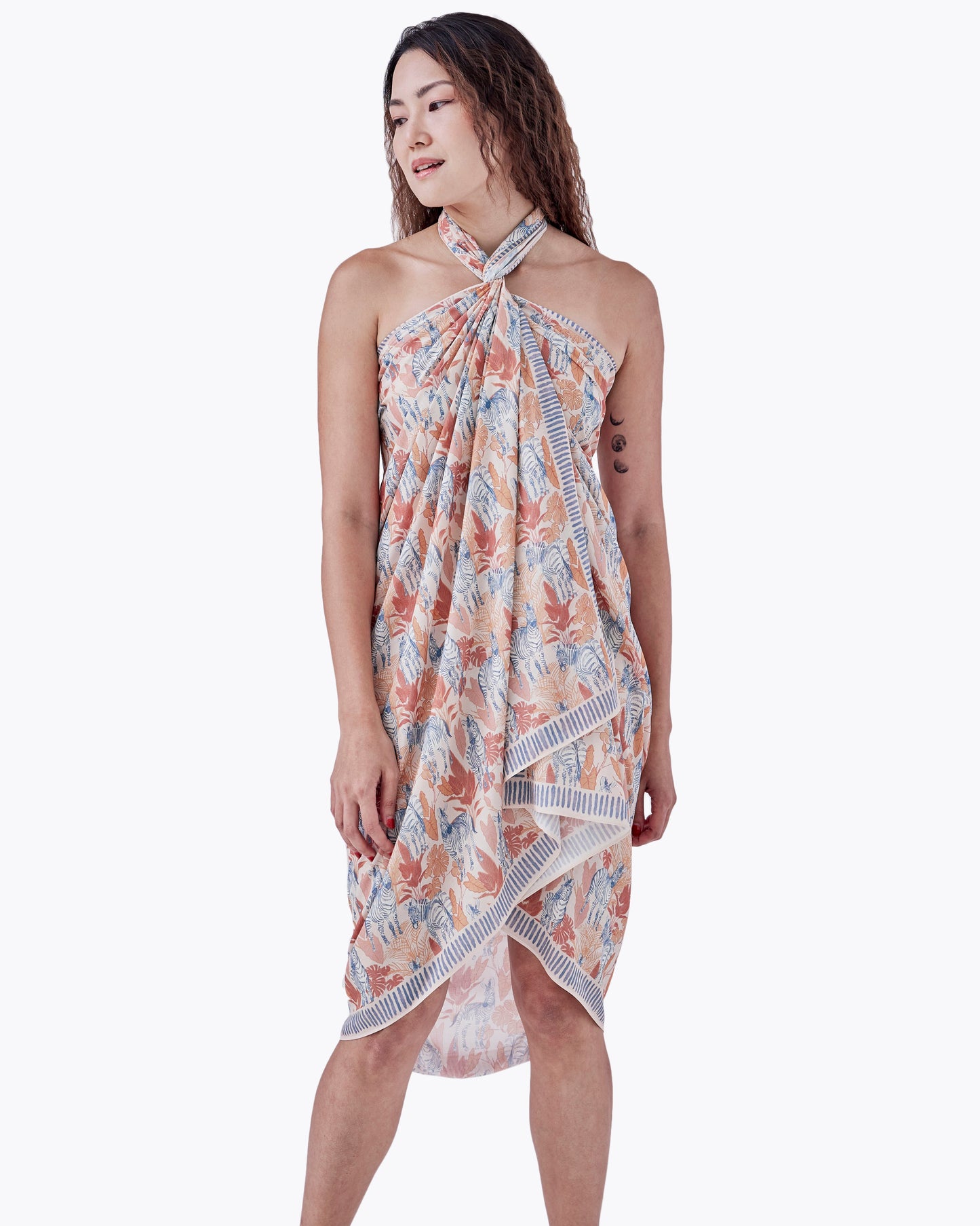Close-up of hand-drawn zebra print on Zebra Sunset pareo — Studio Qiling luxury artist print beach wrap Singapore